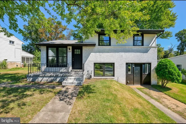 front view of a house with a yard