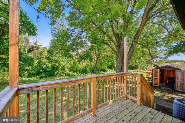 a view of a balcony with wooden floor
