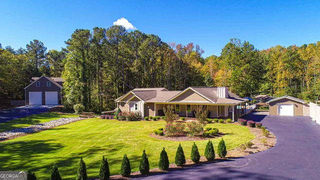 a front view of house with yard outdoor seating and green space