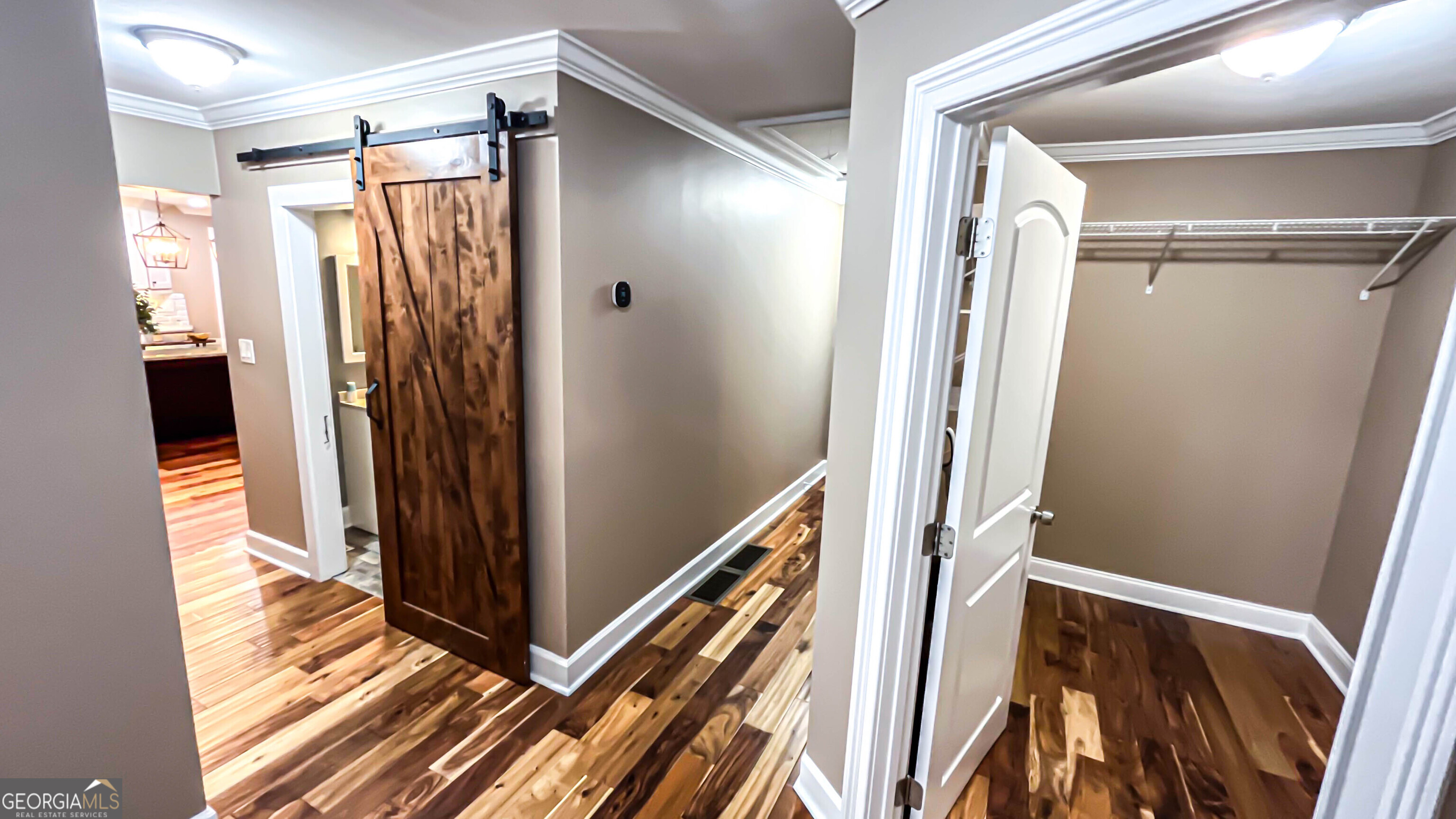 1025 Dailey Mill Road McDonough, GA 30253 - Photo 18 of 58 a view of a hallway with wooden floor and staircase