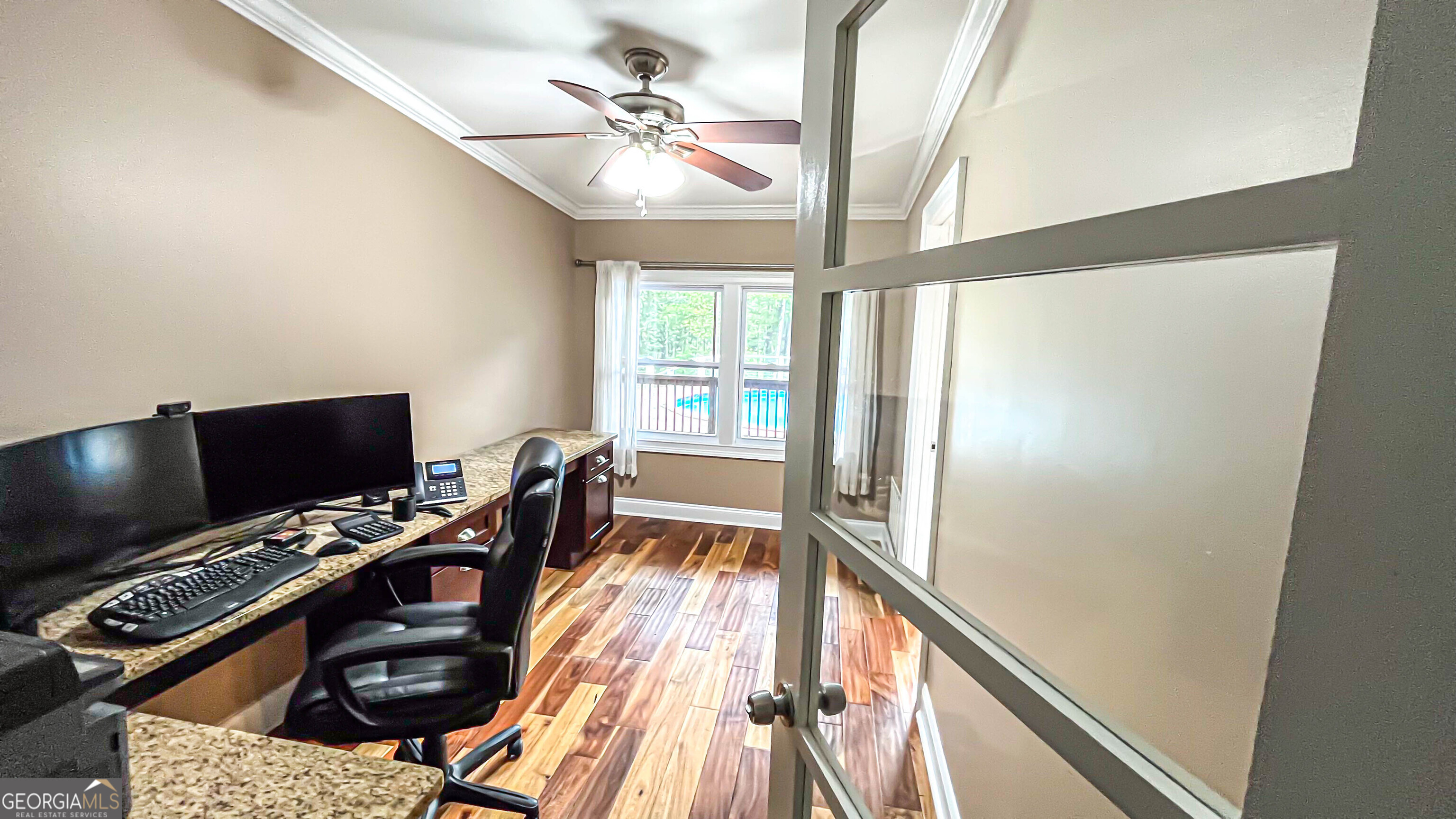 1025 Dailey Mill Road McDonough, GA 30253 - Photo 19 of 58 a view of a livingroom with a flat screen tv and a window