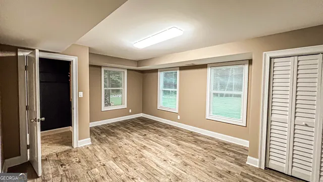 a view of balcony with furniture and window