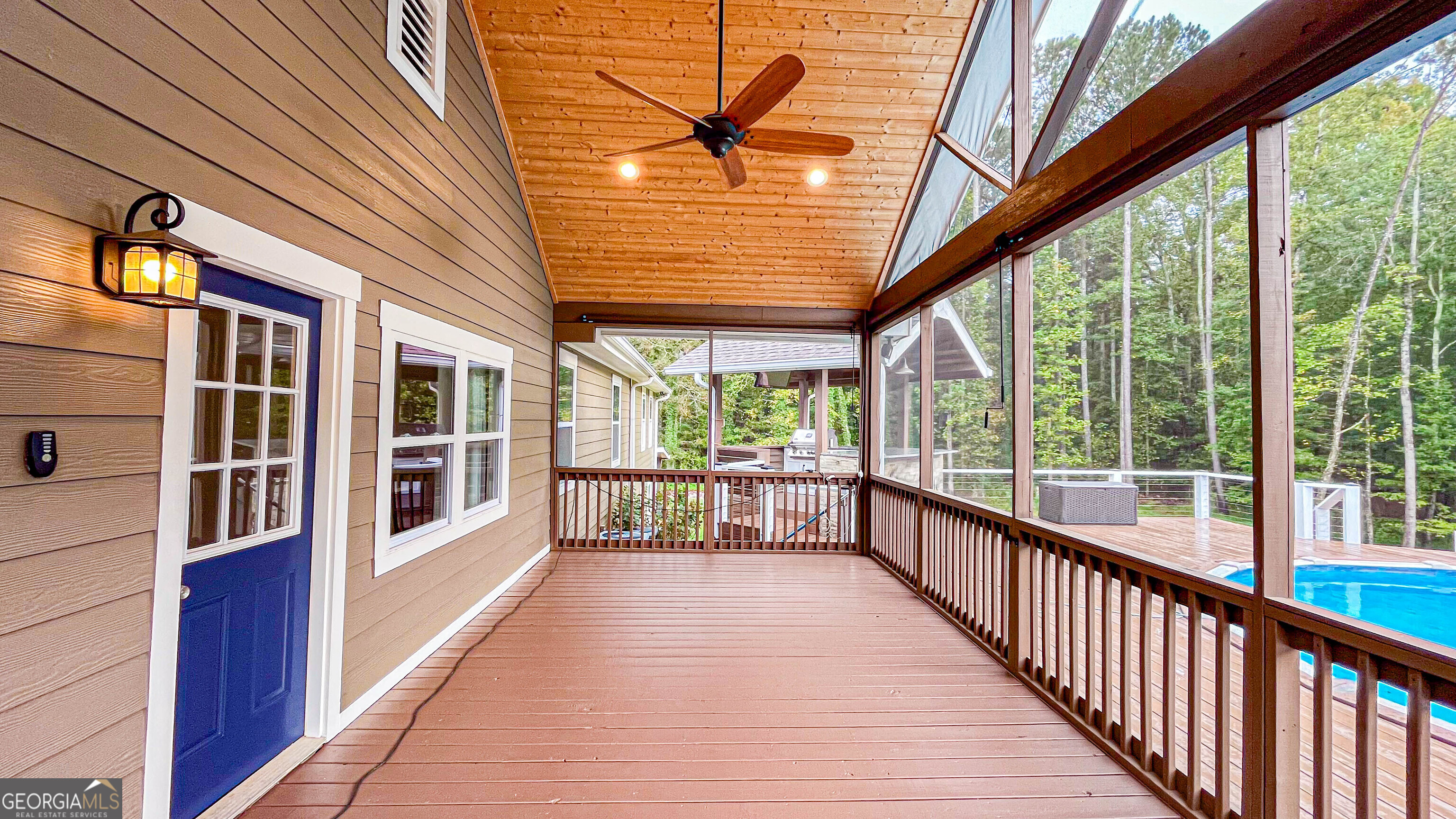 1025 Dailey Mill Road McDonough, GA 30253 - Photo 28 of 58 a view of a porch with wooden floor and stairs