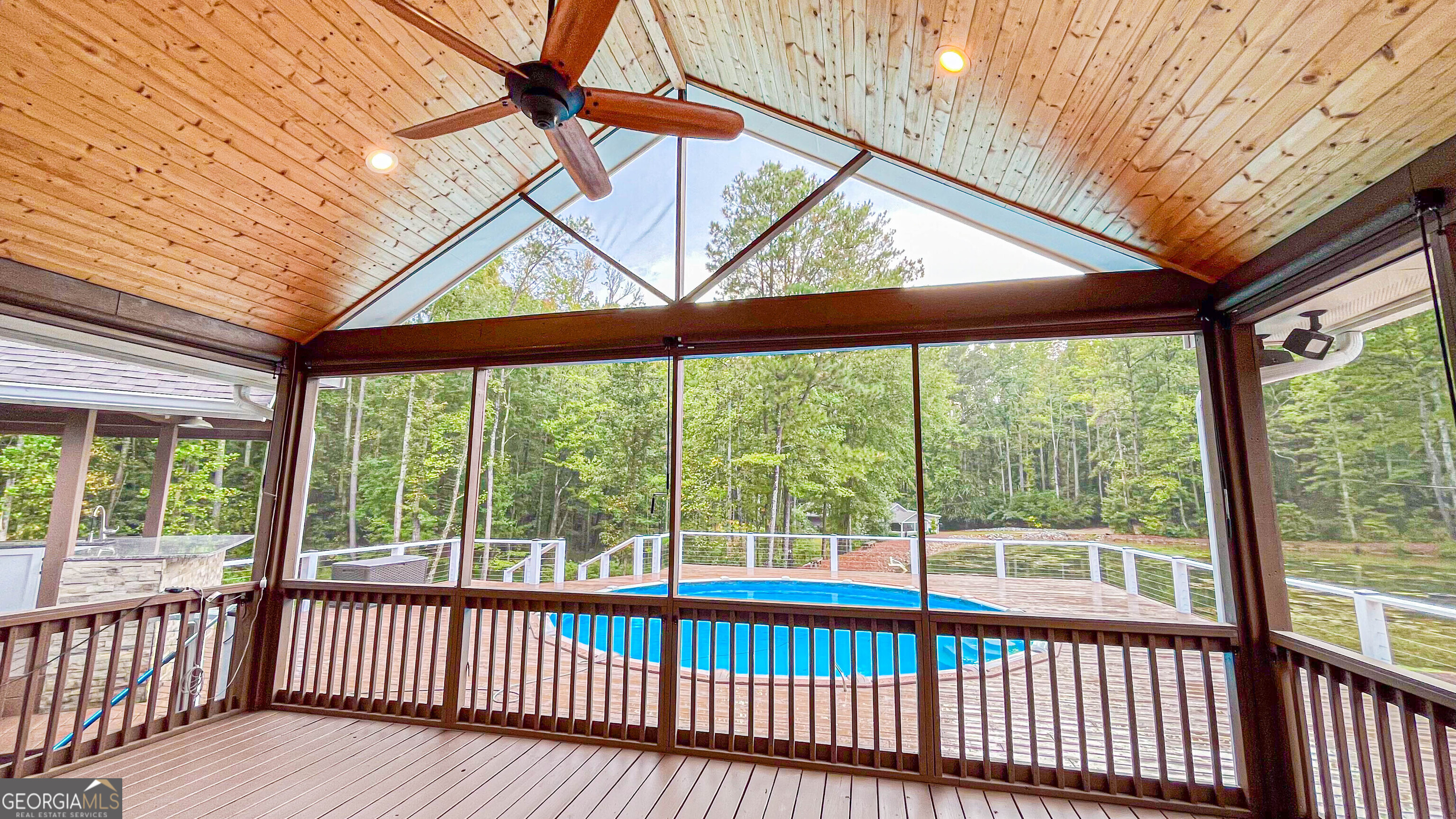 1025 Dailey Mill Road McDonough, GA 30253 - Photo 29 of 58 a view of a porch with wooden floor and outdoor space