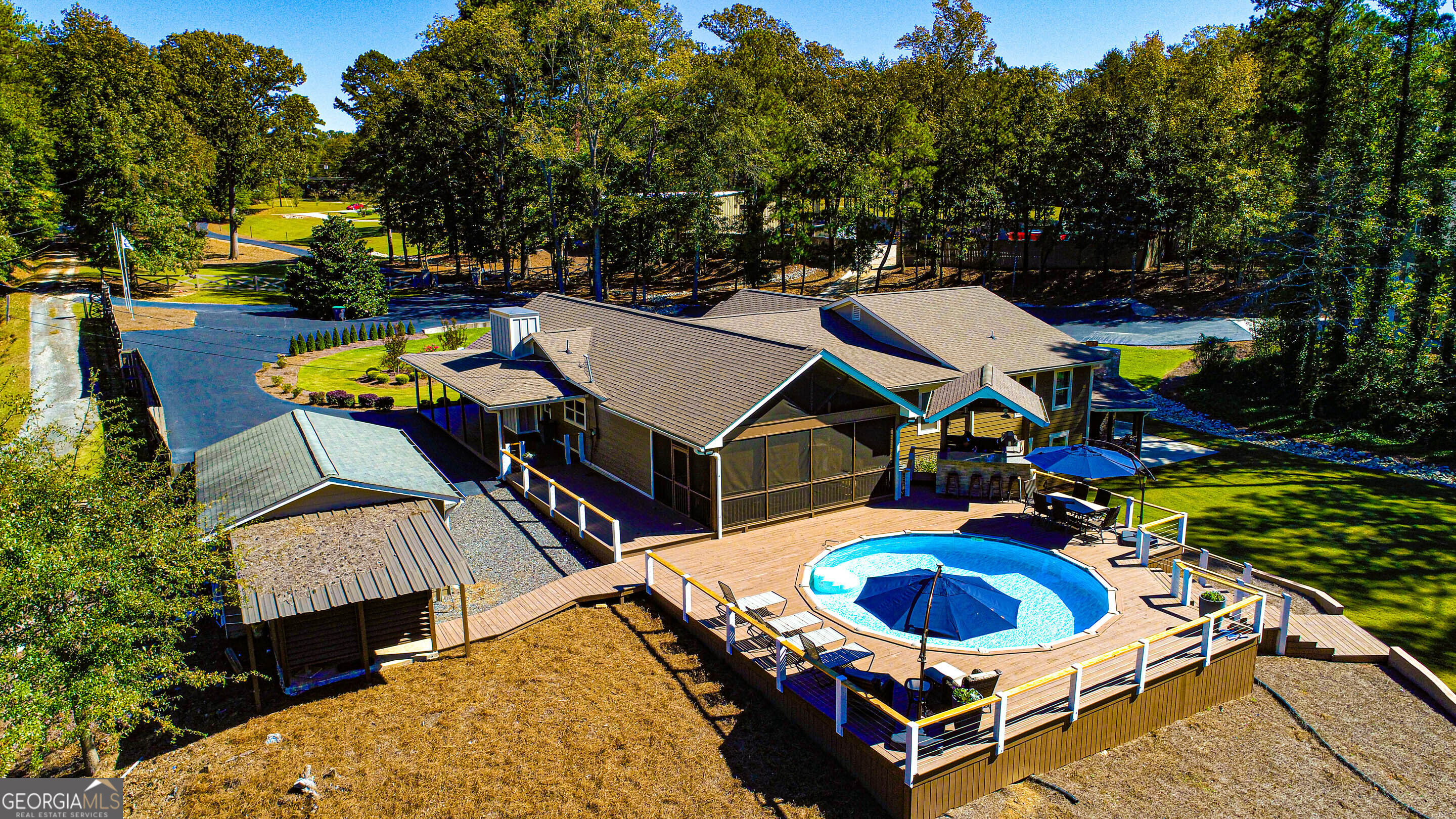 1025 Dailey Mill Road McDonough, GA 30253 - Photo 34 of 58 an aerial view of a house with swimming pool and patio