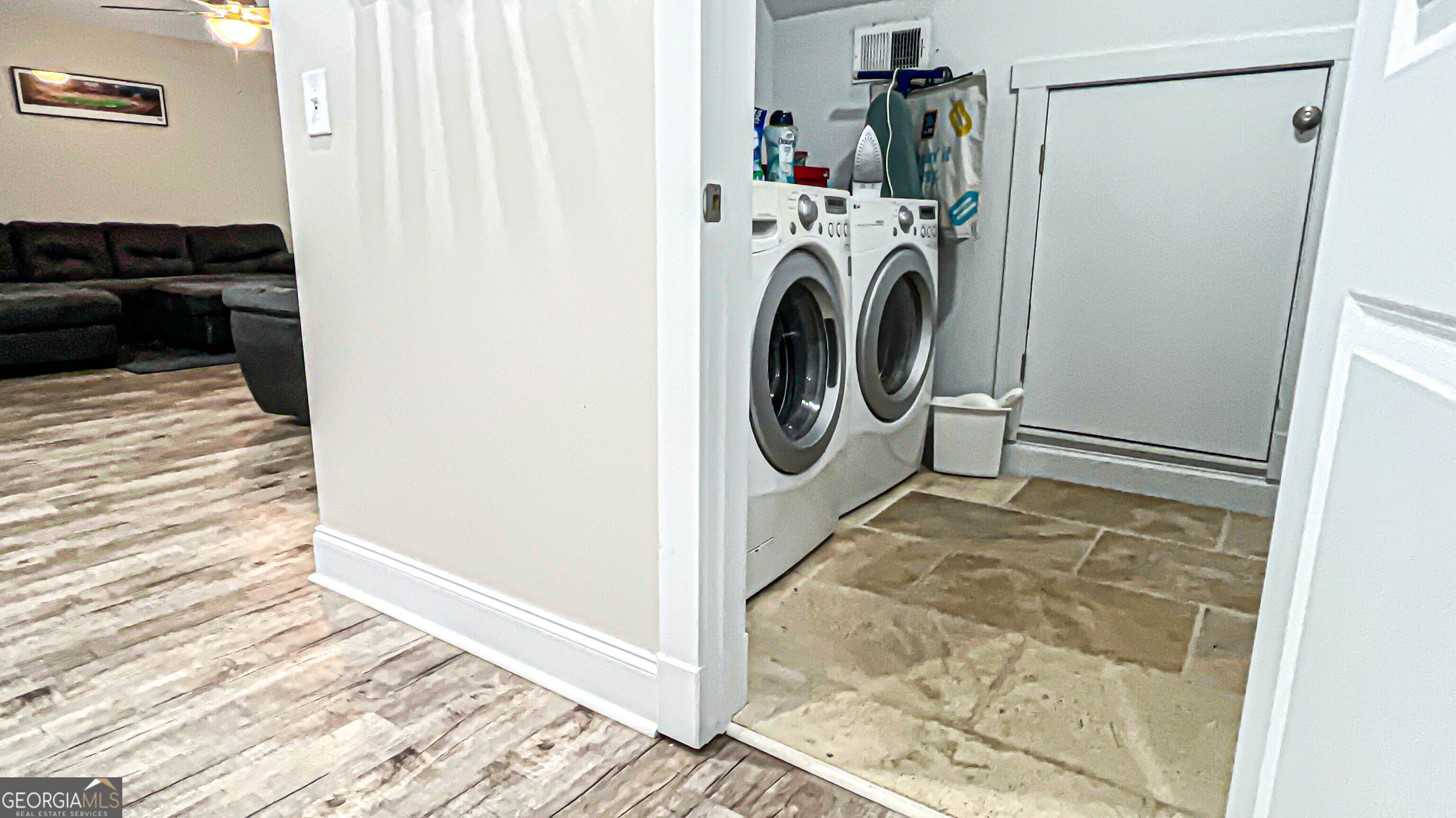 1025 Dailey Mill Road McDonough, GA 30253 - Photo 48 of 58 a view of a storage & utility room with washer and dryer