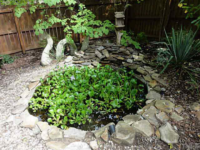 1008 Northclift Drive Raleigh, NC 27609 - Photo 18 of 21 a backyard of a house with lots of green space