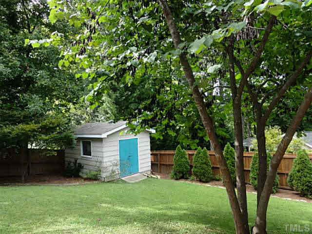 1008 Northclift Drive Raleigh, NC 27609 - Photo 21 of 21 a front view of a house with a garden