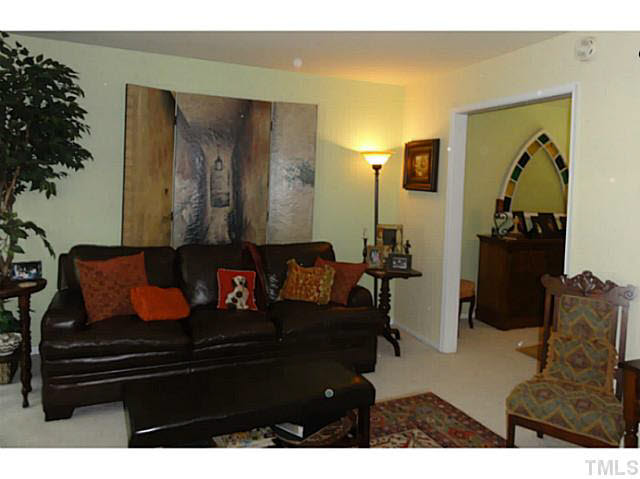 1008 Northclift Drive Raleigh, NC 27609 - Photo 5 of 21 a living room with furniture and a potted plant