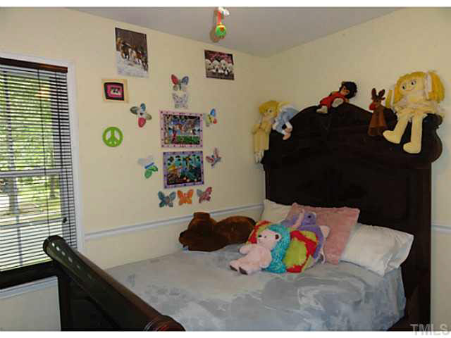1008 Northclift Drive Raleigh, NC 27609 - Photo 9 of 21 a bedroom with a bed and a window