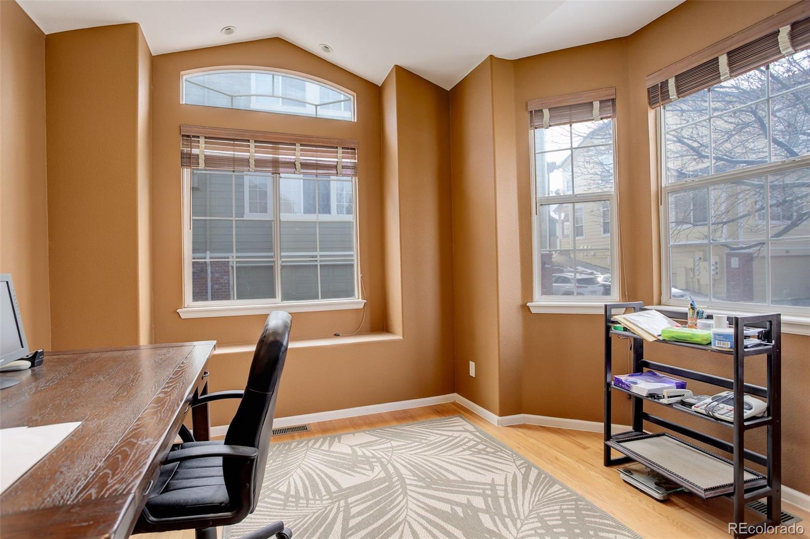 2855 Rock Creek Circle, Unit 129 Louisville, CO 80027 - Photo 8 of 45 a view of a workspace with furniture and a window