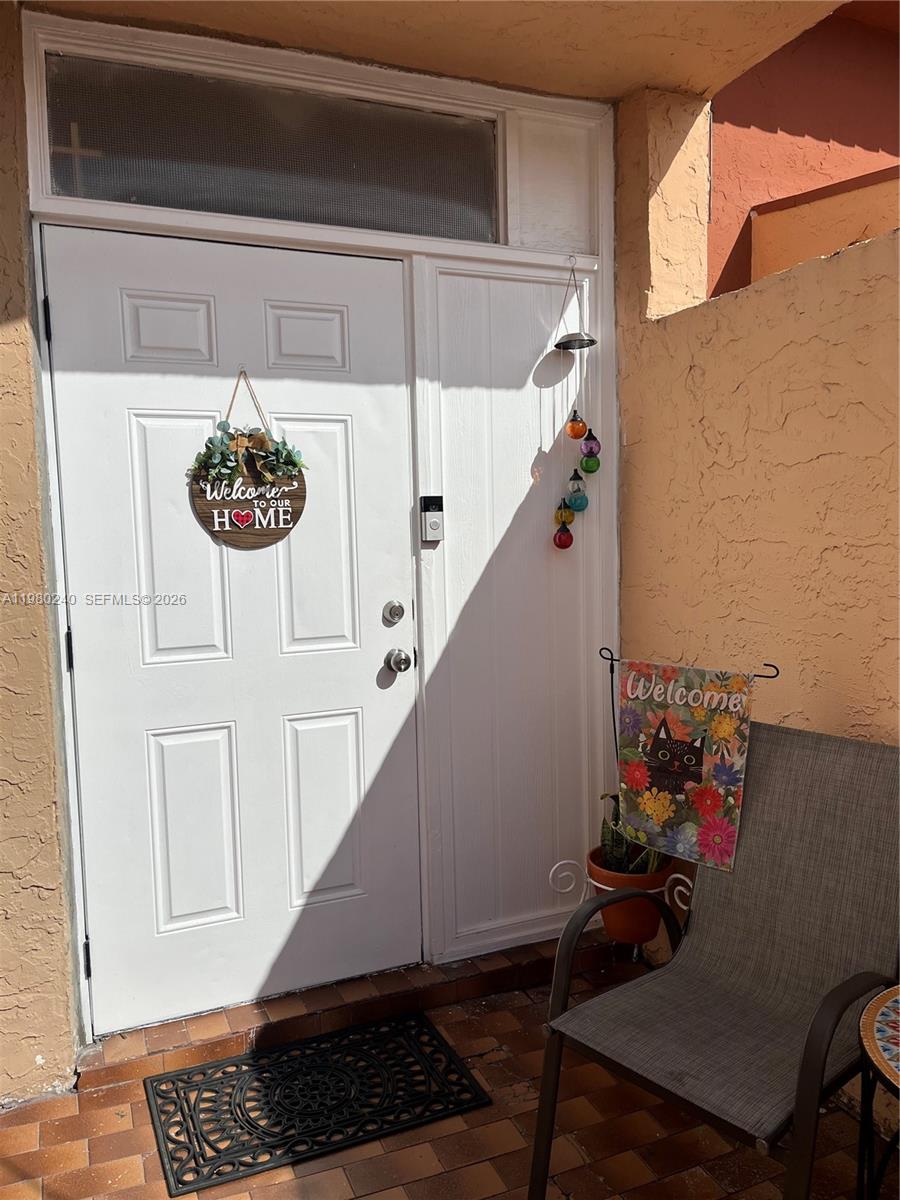 4331 West 11th Lane, Unit 65 Hialeah, FL 33012 - Photo 13 of 21 a view of entryway with wooden floor