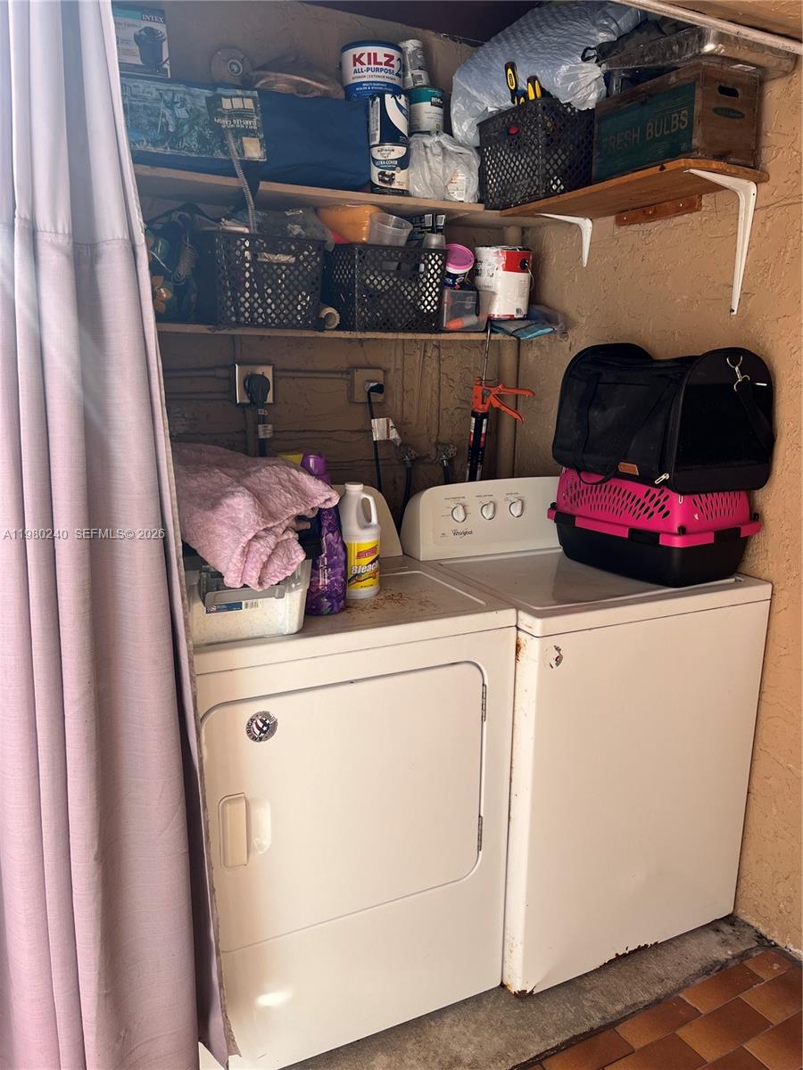 4331 West 11th Lane, Unit 65 Hialeah, FL 33012 - Photo 15 of 21 a utility room with dryer and washer