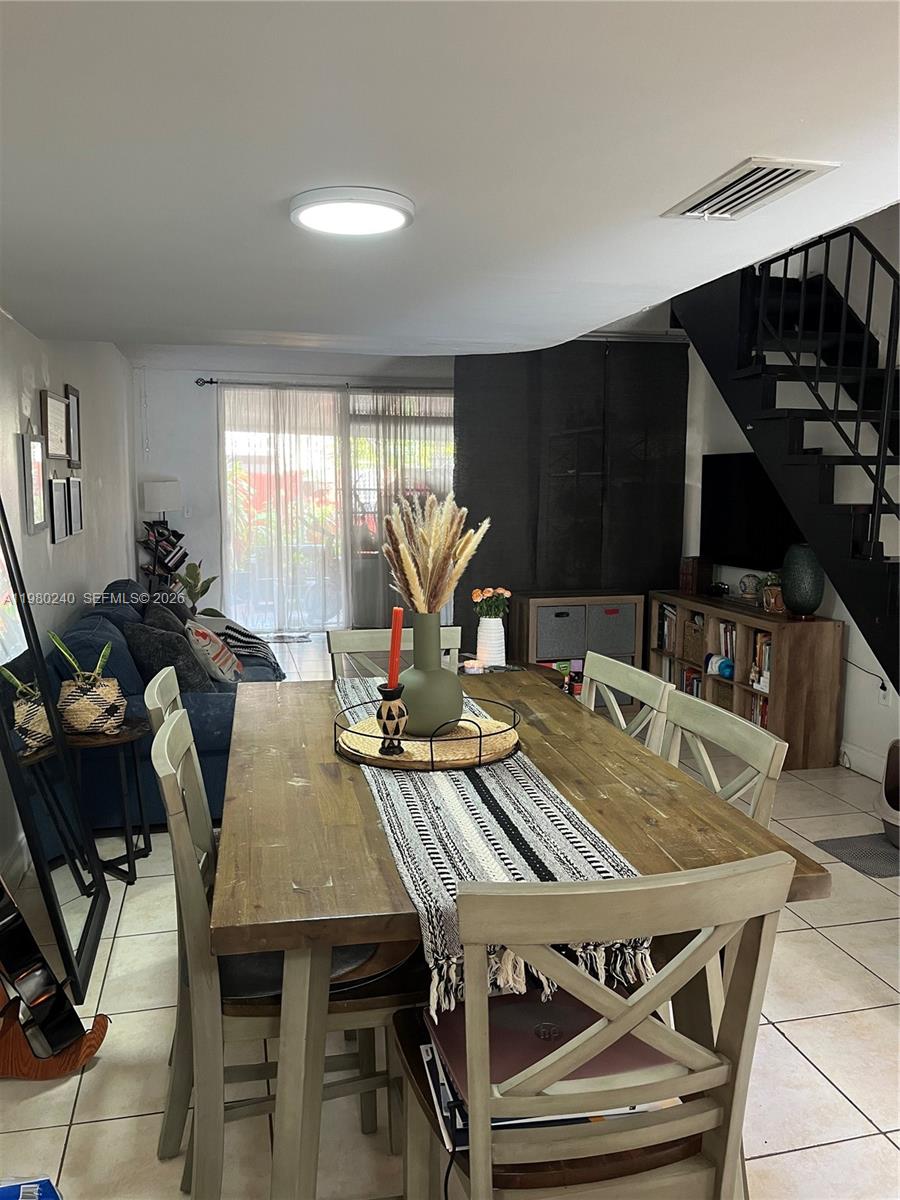 4331 West 11th Lane, Unit 65 Hialeah, FL 33012 - Photo 17 of 21 a view of a dining room with furniture