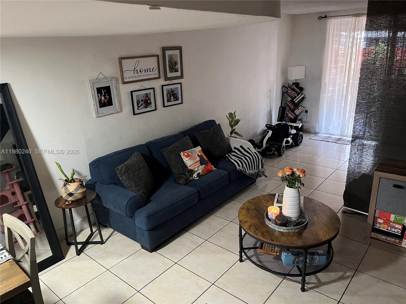 4331 West 11th Lane, Unit 65 Hialeah, FL 33012 - Photo 9 of 21 a living room with furniture