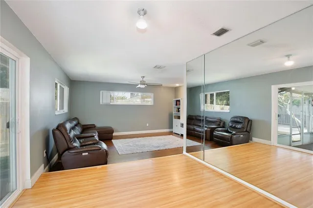 a room with furniture and wooden floor