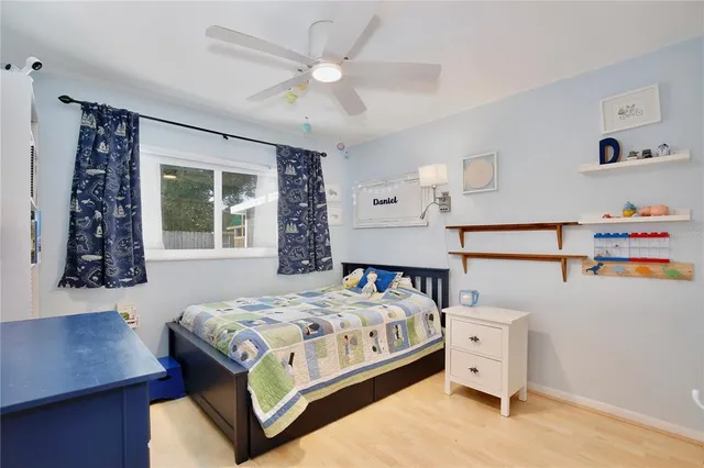 a bedroom with a bed and a window