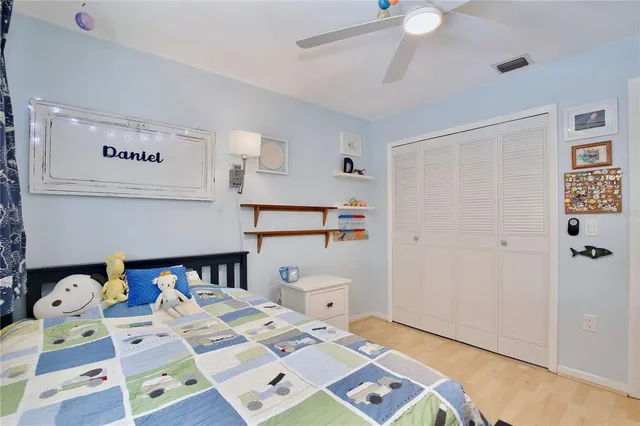 a bed room with a bed and a book shelf