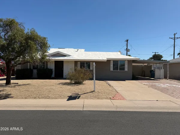 a front view of a house with a garage