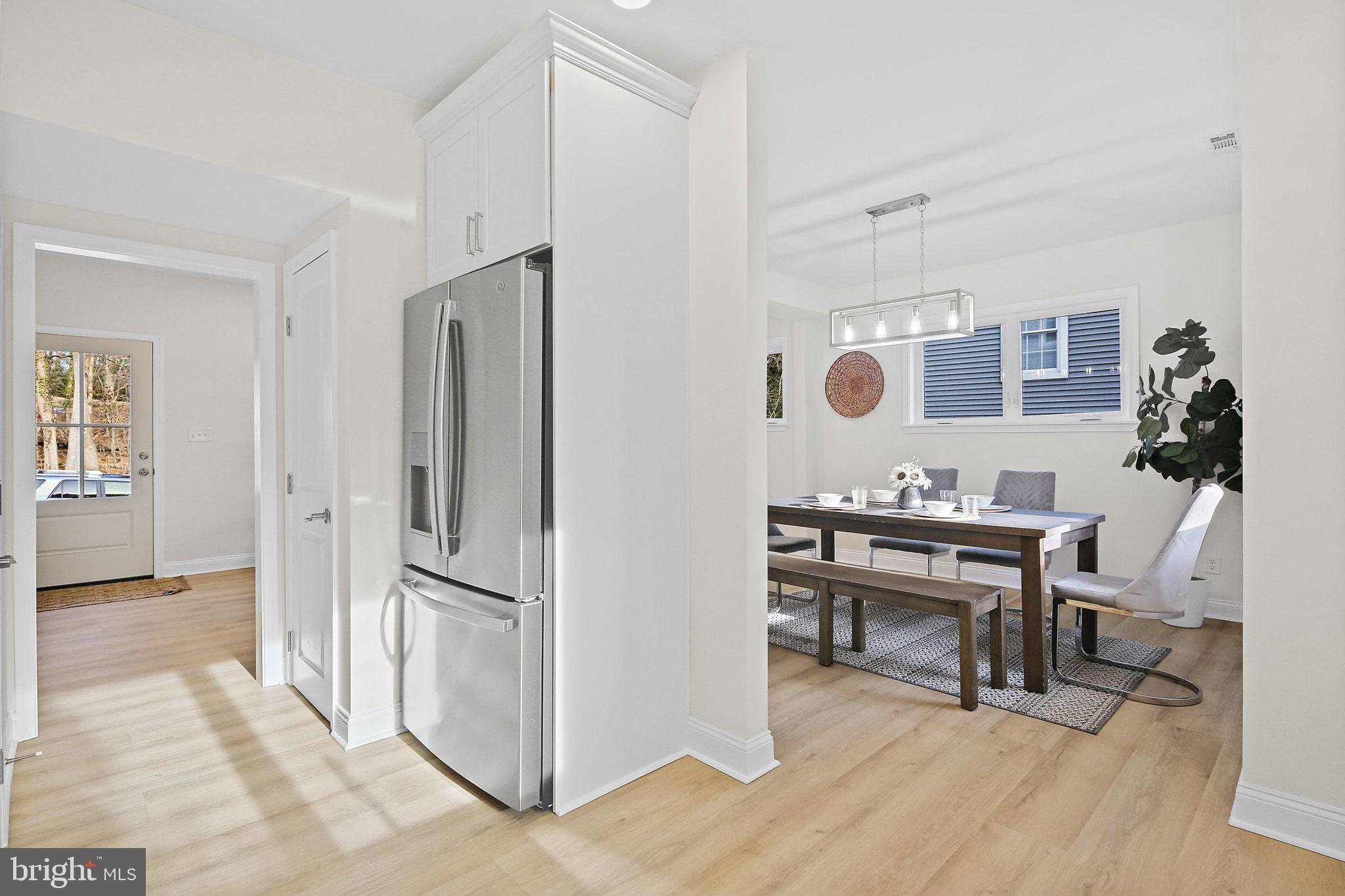 402 Westgate Road Baltimore, MD 21229 - Photo 11 of 37 a view of kitchen with furniture and wooden floor