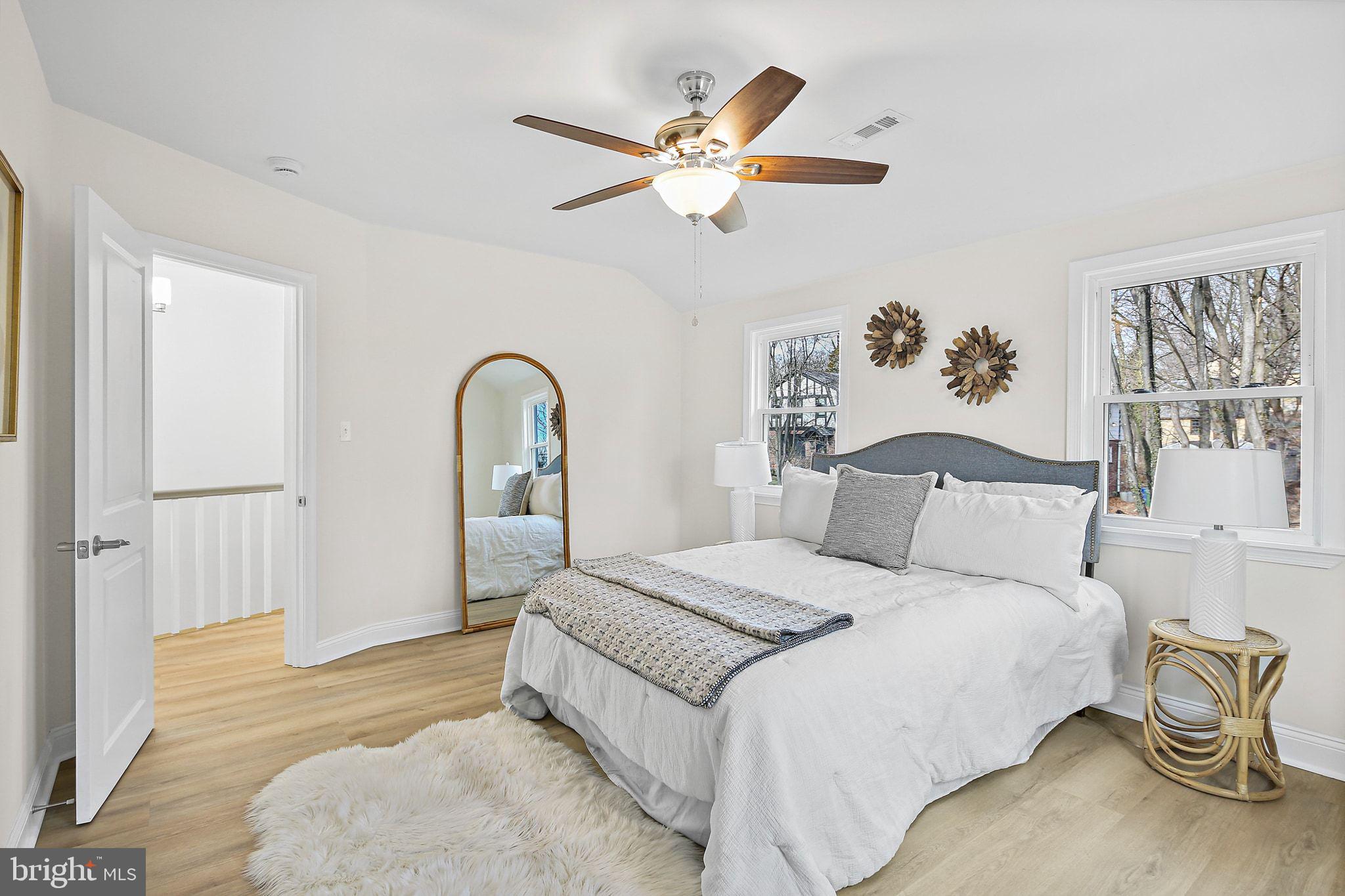 402 Westgate Road Baltimore, MD 21229 - Photo 15 of 37 a bedroom with a bed and a large window