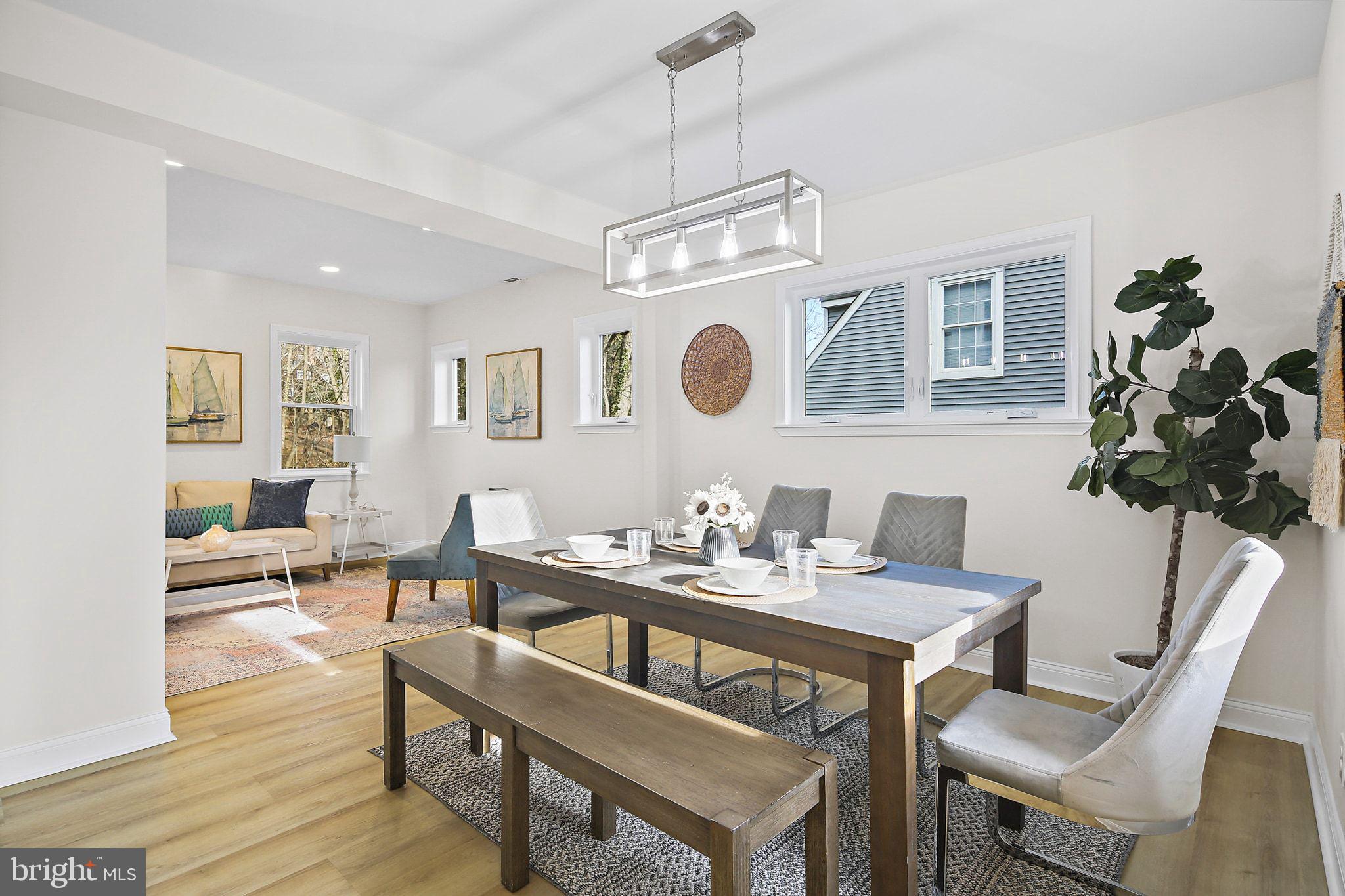 402 Westgate Road Baltimore, MD 21229 - Photo 8 of 37 a view of a dining room with furniture and wooden floor