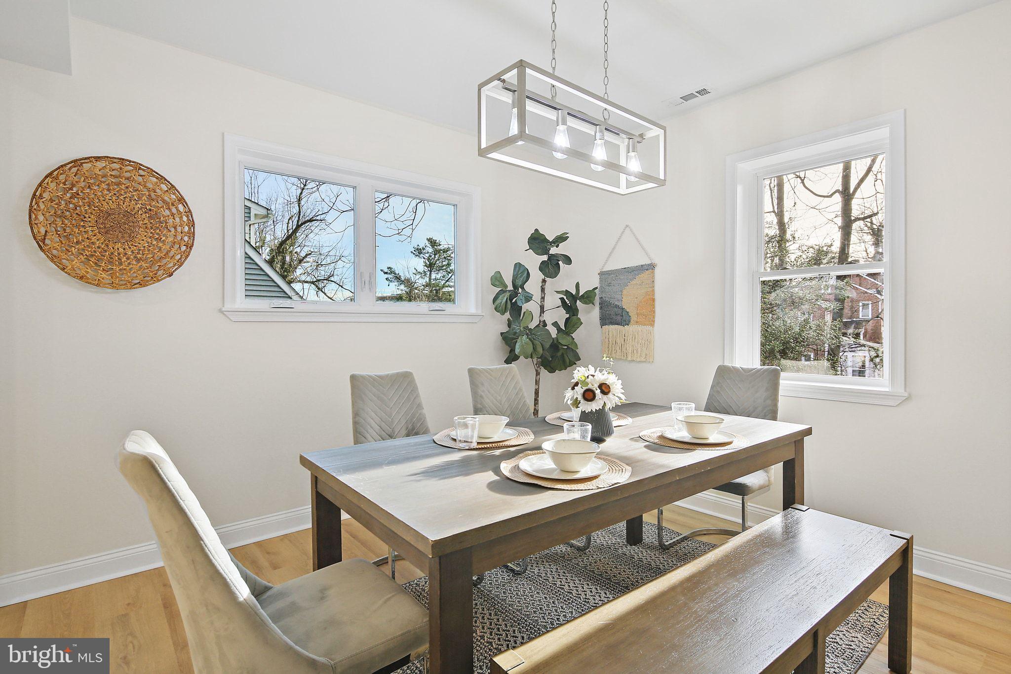 402 Westgate Road Baltimore, MD 21229 - Photo 10 of 37 a view of a dining room with furniture window and wooden floor