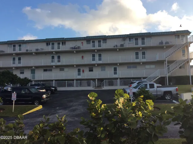 a view of a swimming pool with sitting area