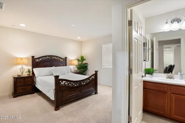 a bedroom with a bed and a dresser