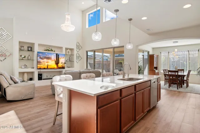 a large kitchen with a table and chairs