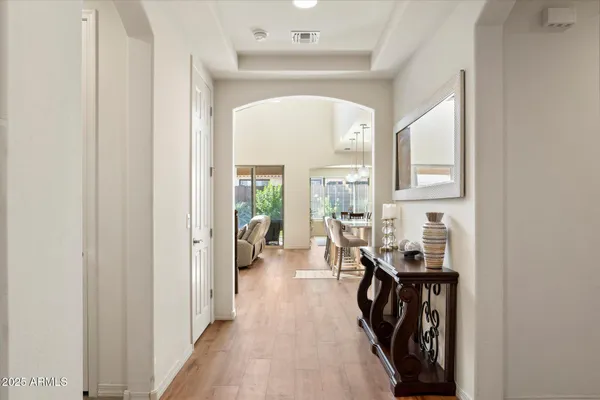 a view of entryway with workspace and a window