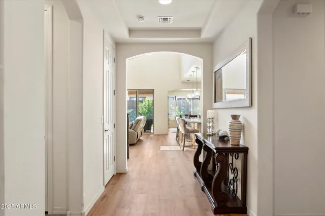 a view of entryway with workspace and a window