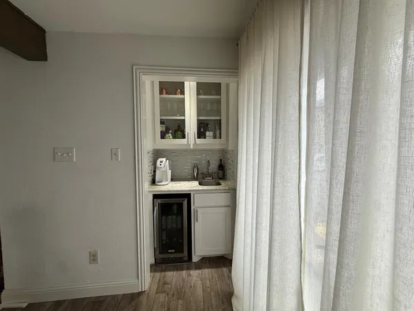 a view of cabinets and wooden floor