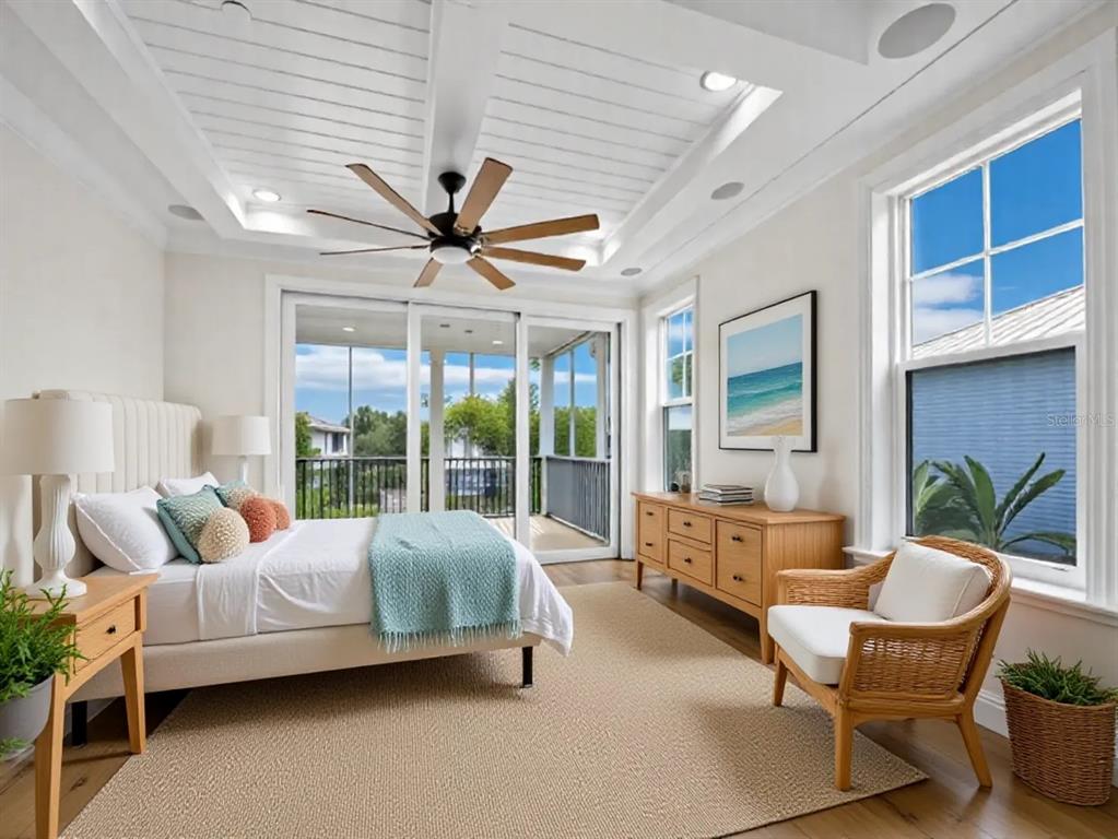 333 Firehouse Court Longboat Key, FL 34228 - Photo 13 of 83 a living room with furniture ceiling fan and a large window