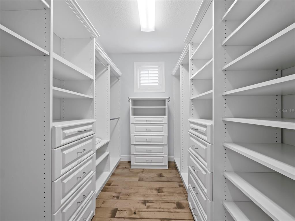 333 Firehouse Court Longboat Key, FL 34228 - Photo 18 of 83 a view of a hallway with closet and racks