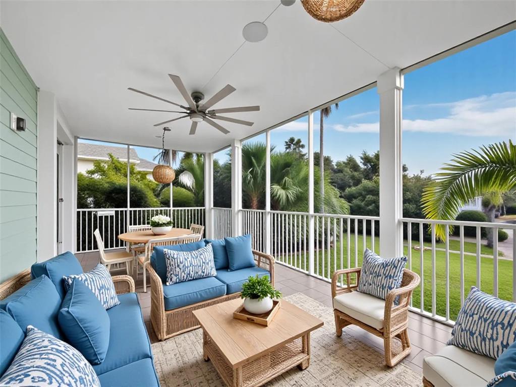 333 Firehouse Court Longboat Key, FL 34228 - Photo 20 of 83 a living room with furniture and a large window