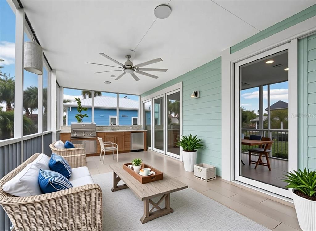 333 Firehouse Court Longboat Key, FL 34228 - Photo 22 of 83 a living room with furniture and a large window