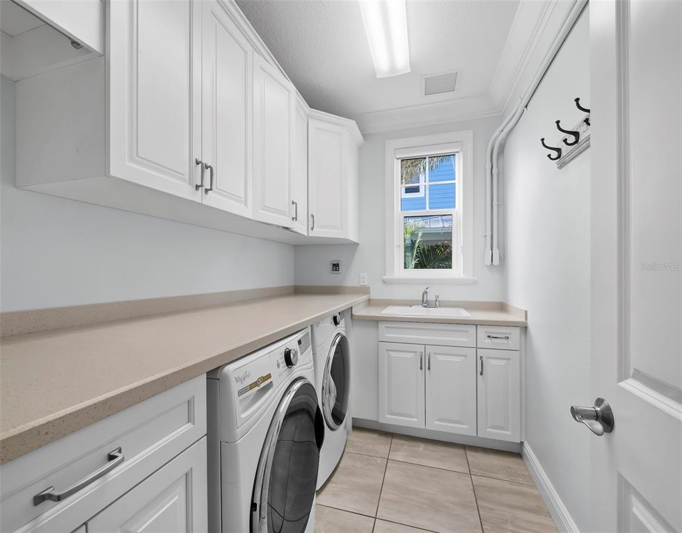 333 Firehouse Court Longboat Key, FL 34228 - Photo 23 of 83 a utility room with sink dryer and washer