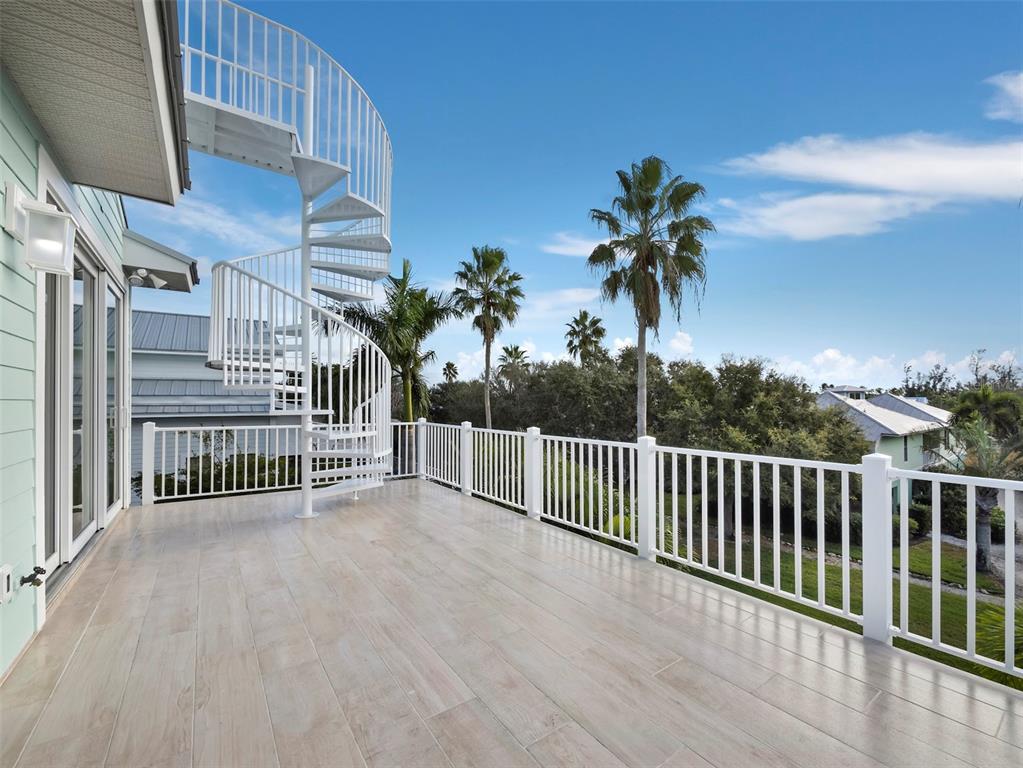 333 Firehouse Court Longboat Key, FL 34228 - Photo 35 of 83 a view of a balcony with a palm tree