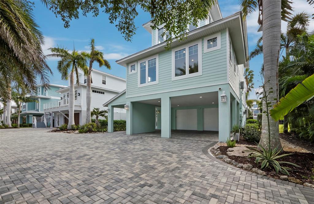 333 Firehouse Court Longboat Key, FL 34228 - Photo 48 of 83 a front view of a house with a yard