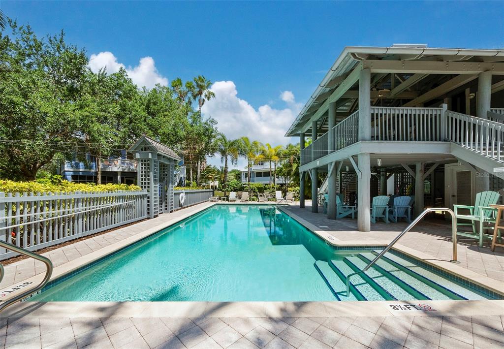 333 Firehouse Court Longboat Key, FL 34228 - Photo 53 of 83 a view of a swimming pool with sitting area