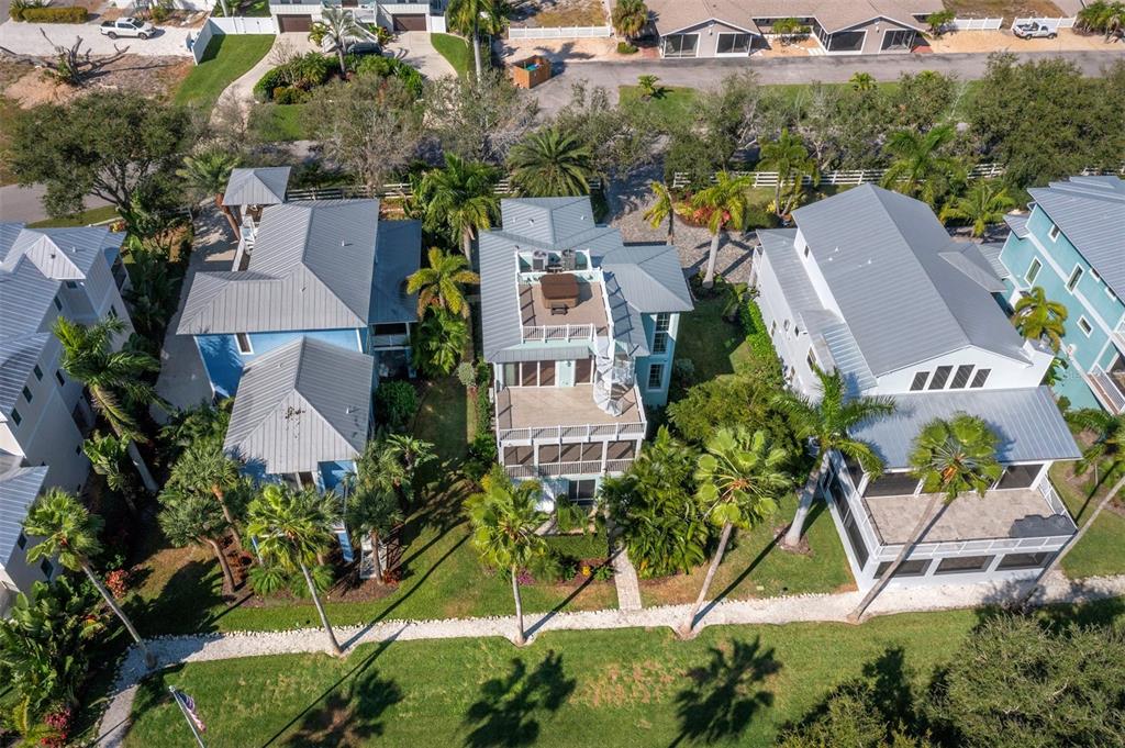 333 Firehouse Court Longboat Key, FL 34228 - Photo 59 of 83 an aerial view of a house with yard and swimming pool