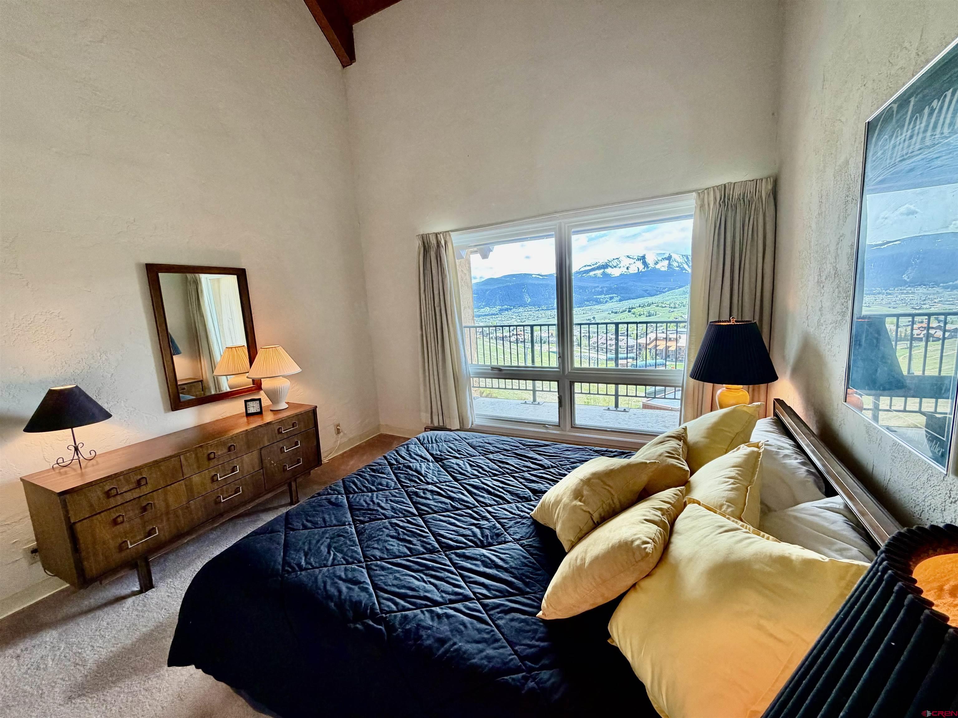 51 Whetstone Road, Unit 2306 Crested Butte, CO 81225 - Photo 23 of 44 a bedroom with a bed and window