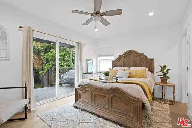 a view of a balcony with wooden floor