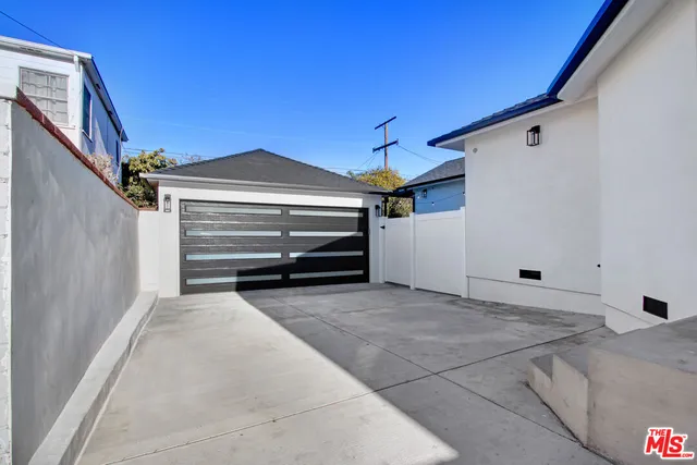 a front view of a house with yard and green space