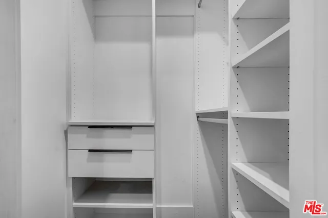 a view of an empty walk in closet