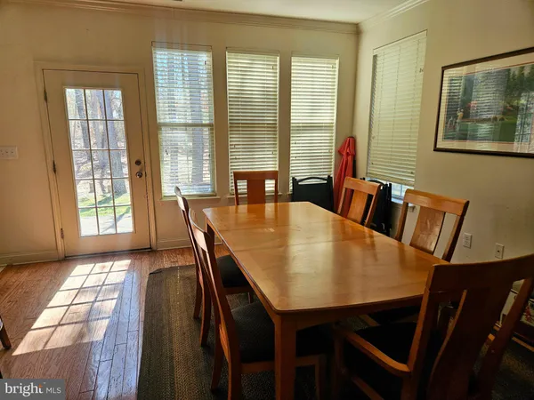 a view of a dining room with furniture and window