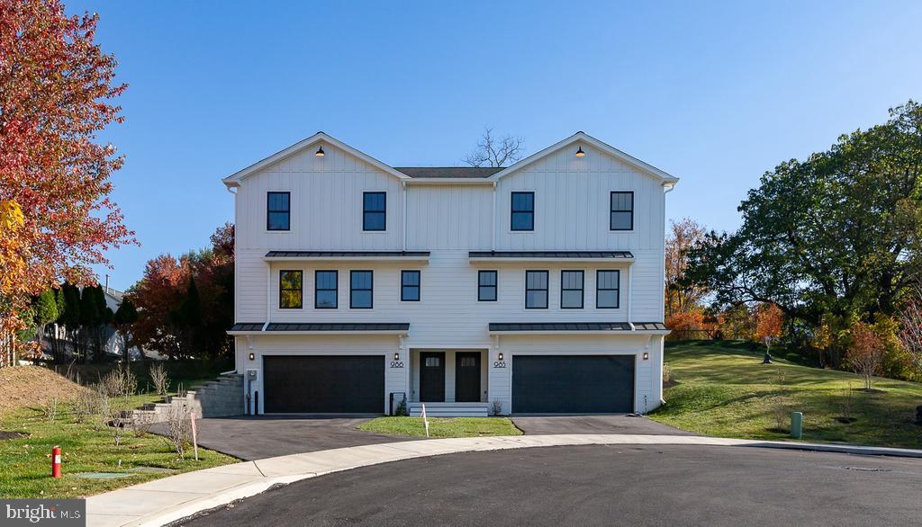 986 Henry Avenue Wayne, PA 19087 - Photo 1 of 32 a front view of a house with a yard and garage