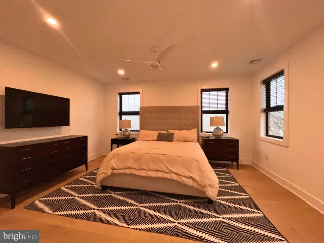 a view of hallway with wooden floor and furniture