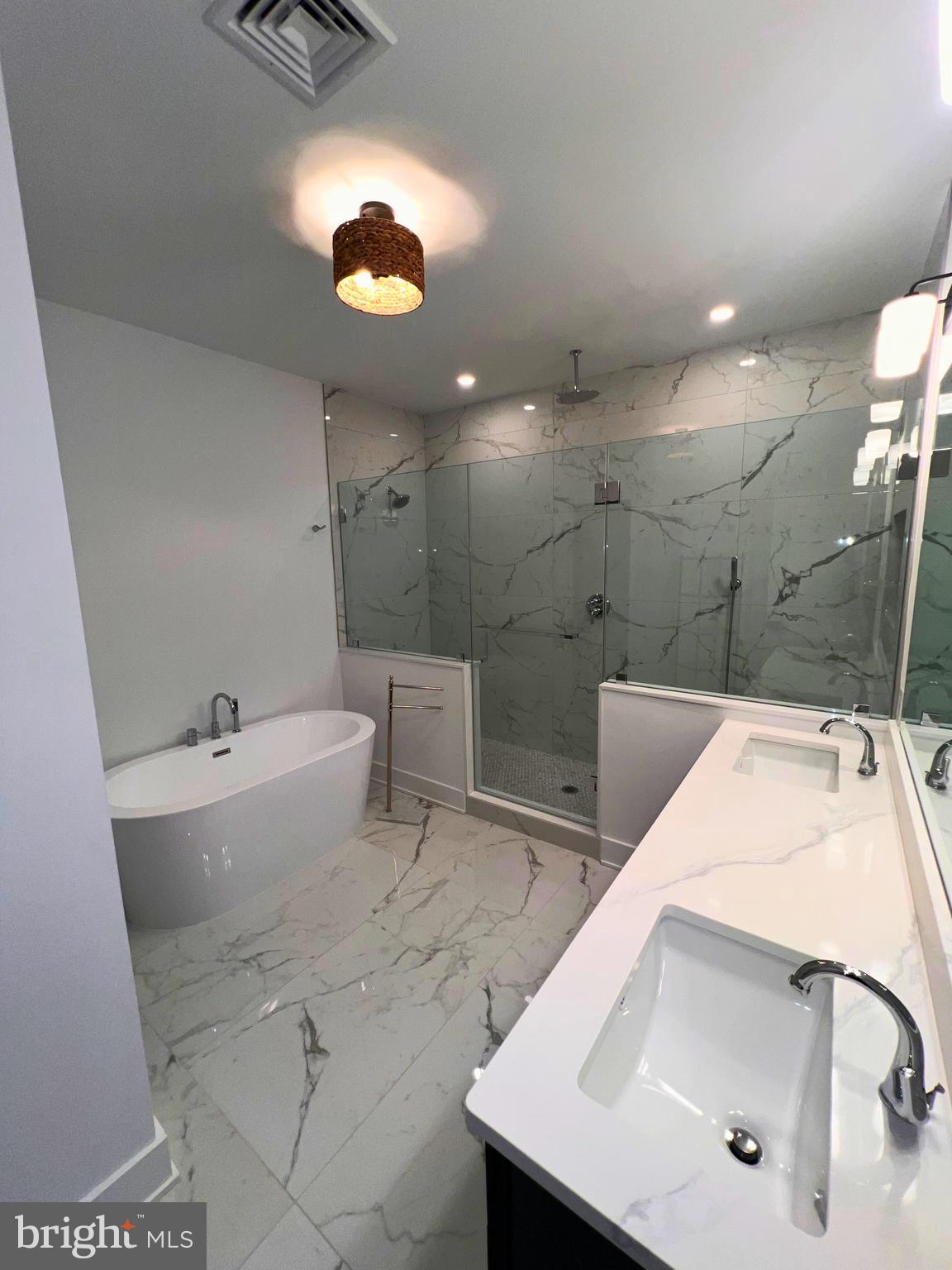 986 Henry Avenue Wayne, PA 19087 - Photo 17 of 32 a bathroom with a sink a toilet and bathtub